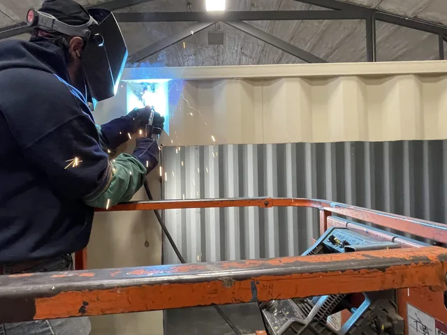 Container conversion showing insulated walls and recessed lighting