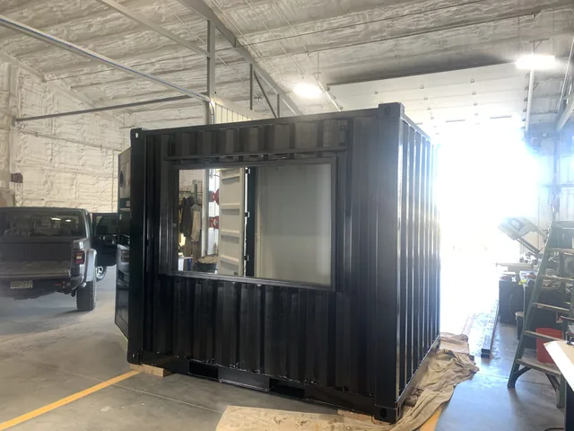 Container modification showing built-in desk and work surface