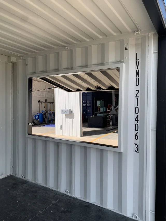 Modified container showing insulated ceiling panels and LED lighting