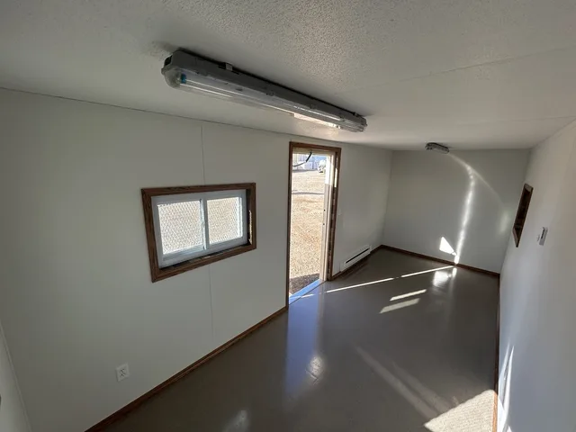 Office container conversion showing finished interior workspace setup