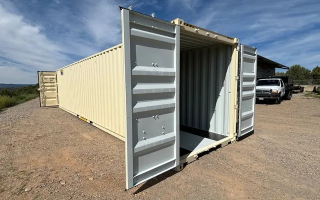 Container positioned alongside a building for supplemental storage