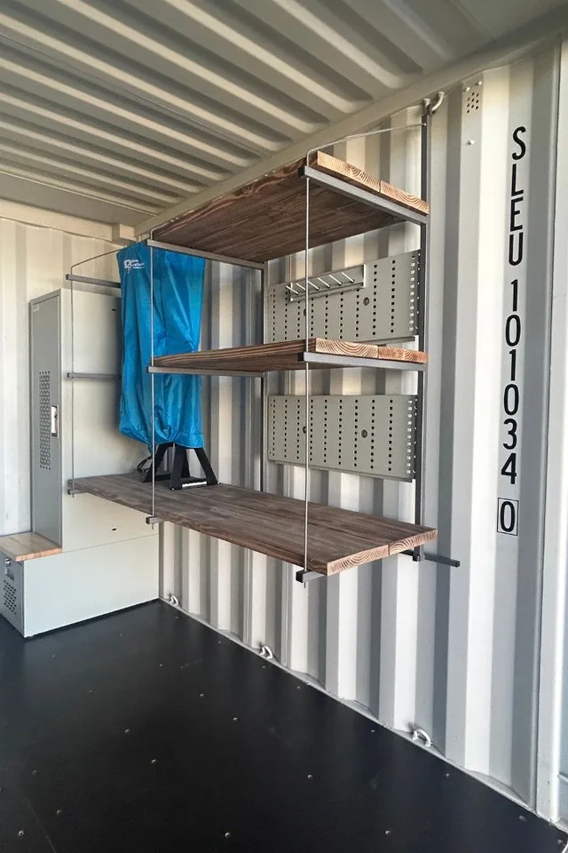 Shelving project in progress — uprights and cross-braces being installed