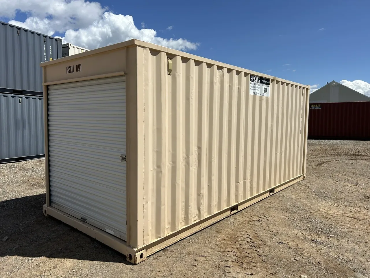 Custom modified storage container with roll-up door